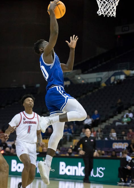 Nicolas Elame (20) leaps to dunk on a fast break during the University of Texas at Arlington vs. Louisiana men’s basketball game in the first round of the Sun Belt Conference championship tournament at the Pensacola Bay Center in Pensacola on Thursday, March 3, 2022.